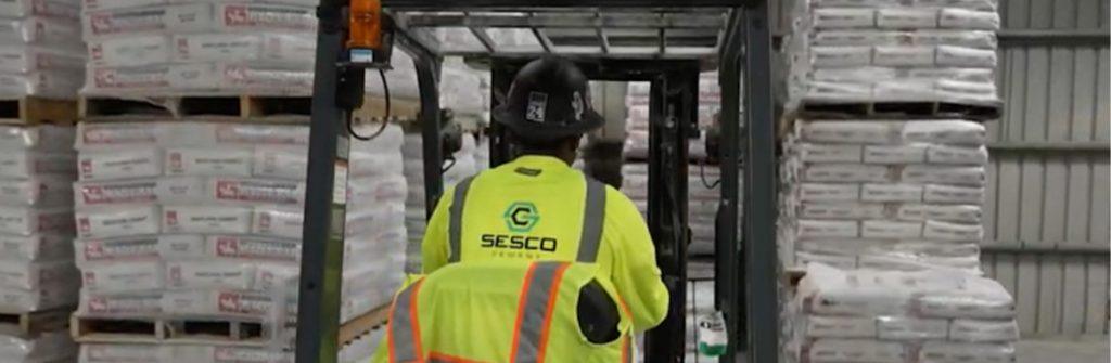 SESCO Cement worker using a forklift to move cement ordered by a customer through the new SESCO software portal