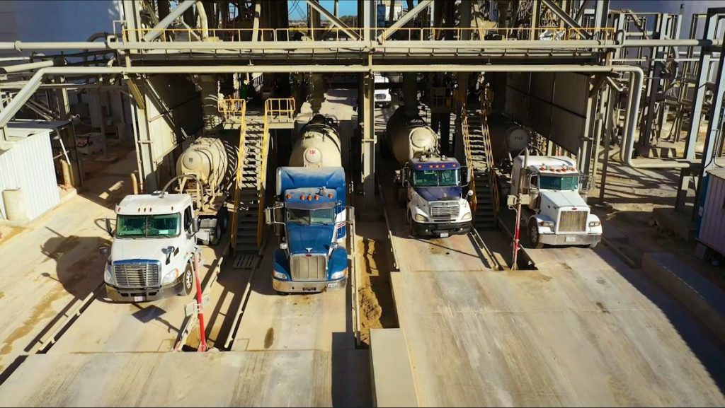 Cement terminal filling up trucks with cement