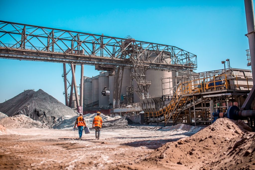 Construction workers walking a job site that uses cement from SESCO Cement